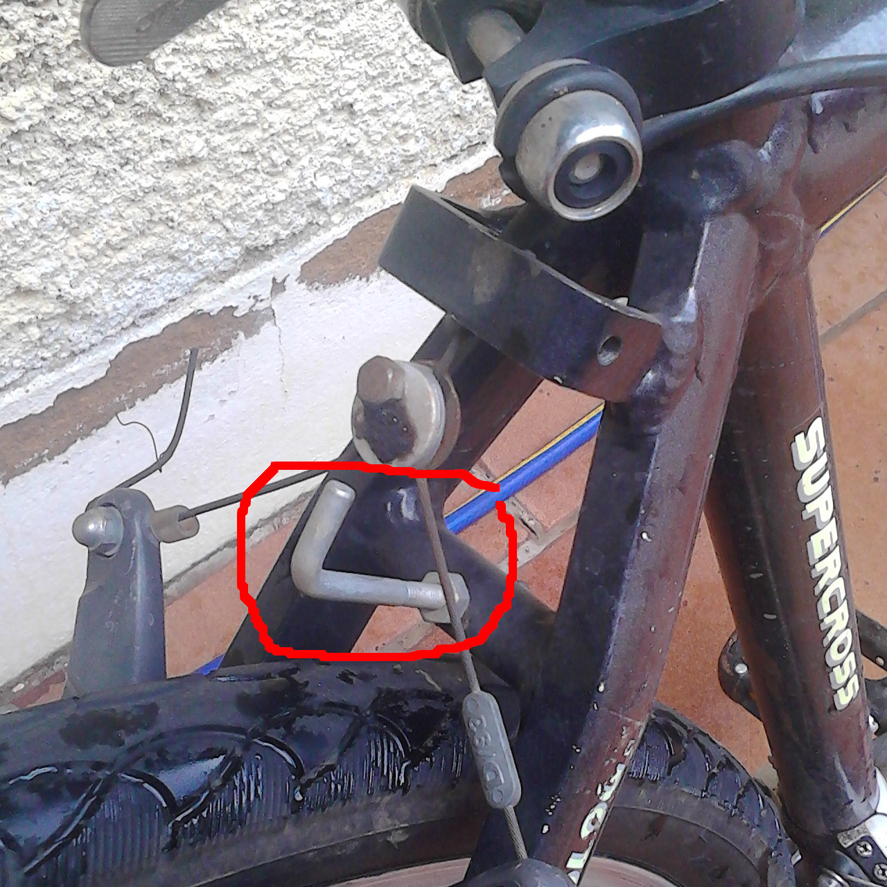 Hook on the rear tube, circled in red